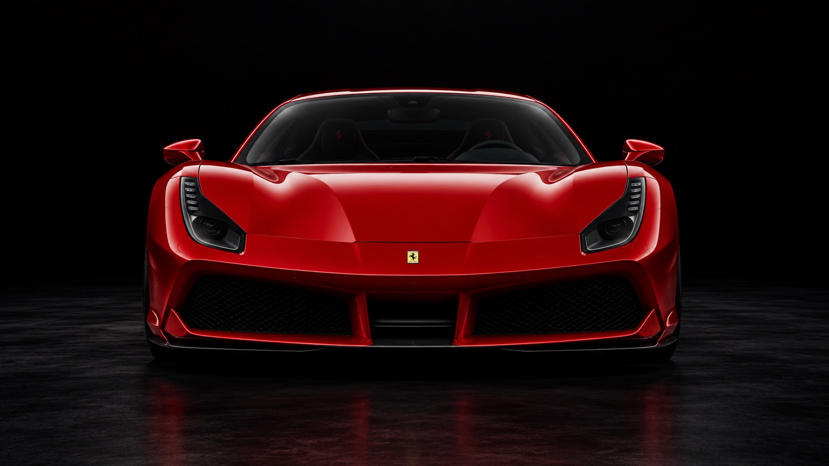 Cena conceitual: frente de uma Ferrari vermelha em um estúdio escuro